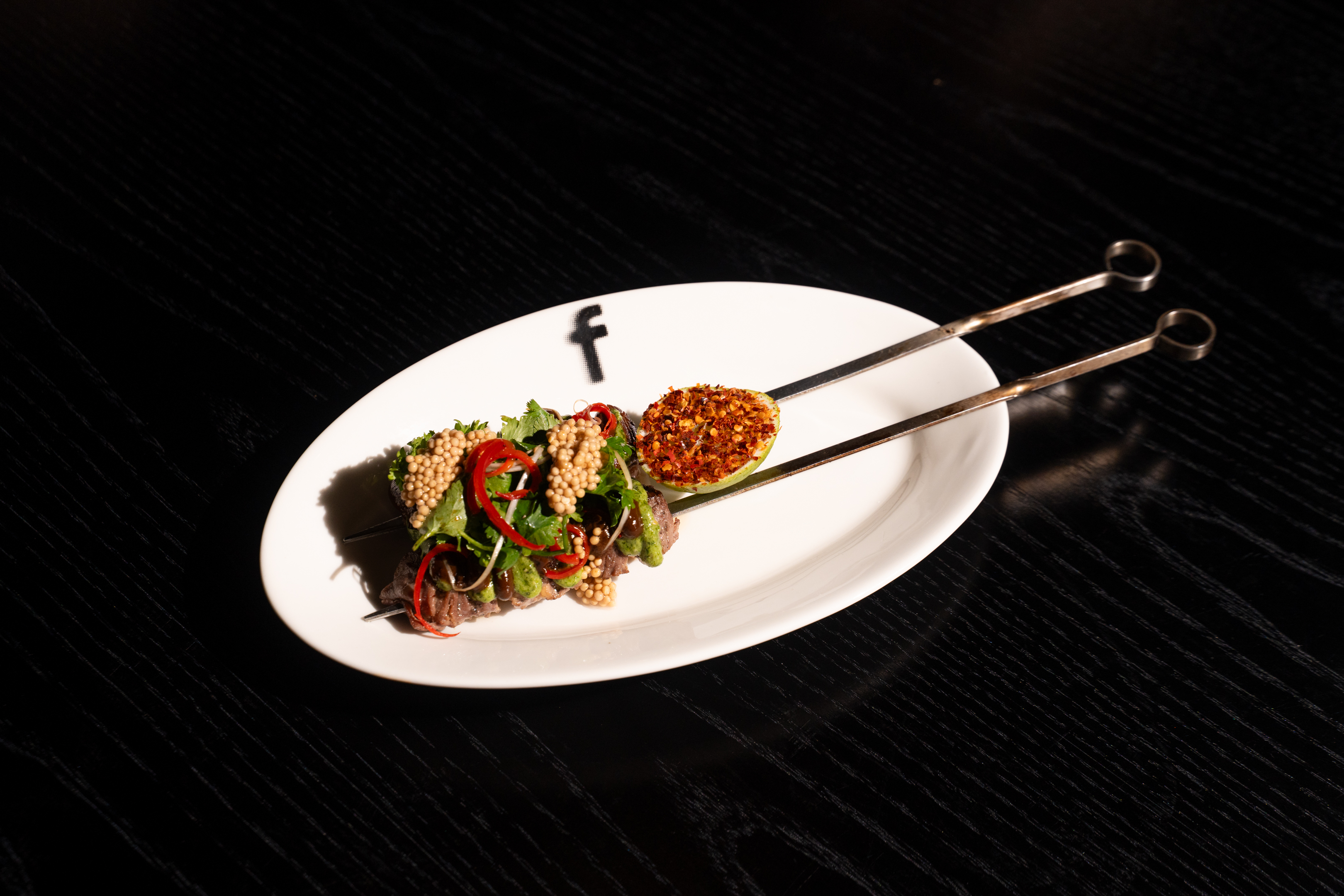 Beef Skewers, Black Garlic Mint and Spring Onion Chiffonade